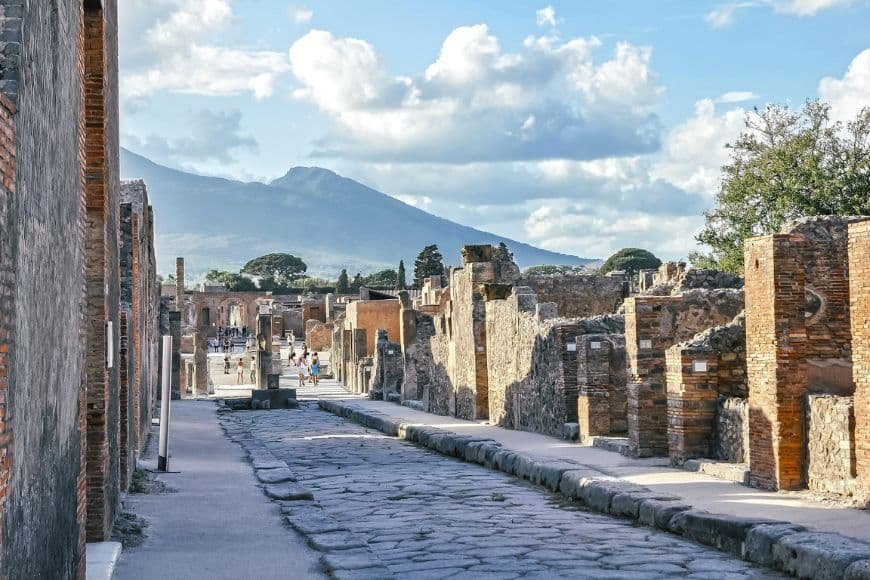 Naples Travel Guide, View of Pompeii ruins with Mount Vesuvius in the background