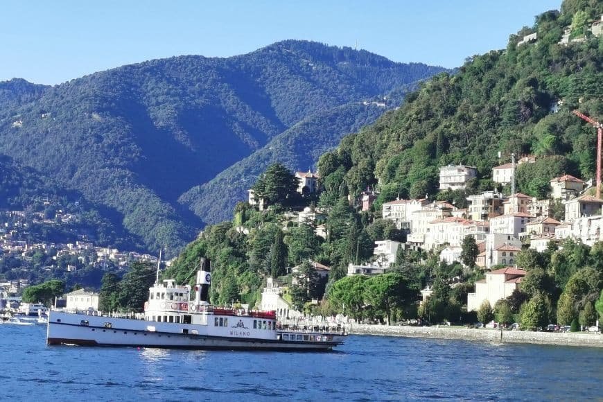 Things to Do in Lake Como, Ferry crossing Lake Como with mountain scenery