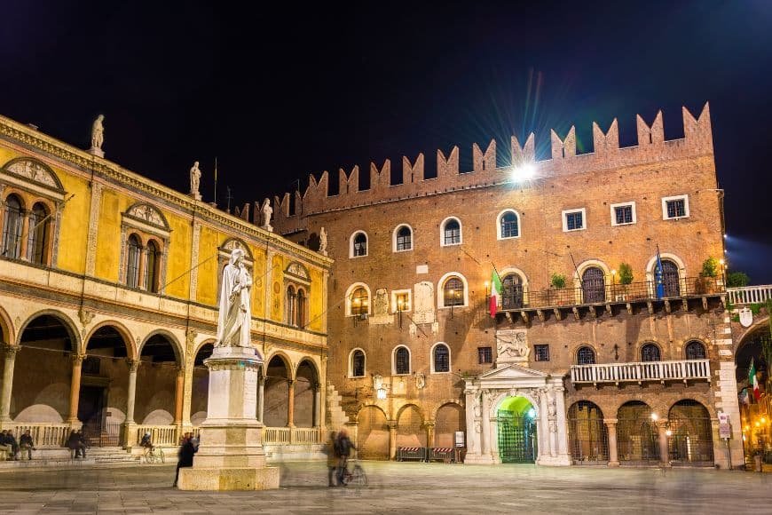 Things to do in Verona, Piazza dei Signori with Dante statue and historic buildings