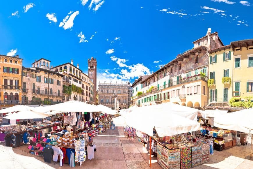 One Day in Verona, Piazza delle Erbe with colorful facades and market stalls in Verona