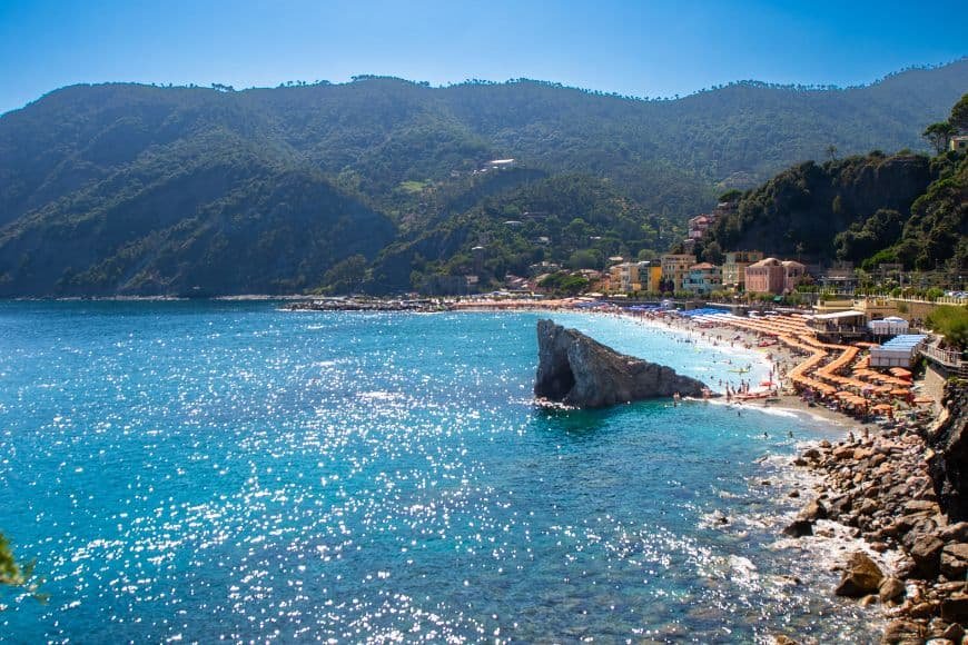 Things to Do in Cinque Terre, Fegina Beach in Monterosso with umbrellas along the shore