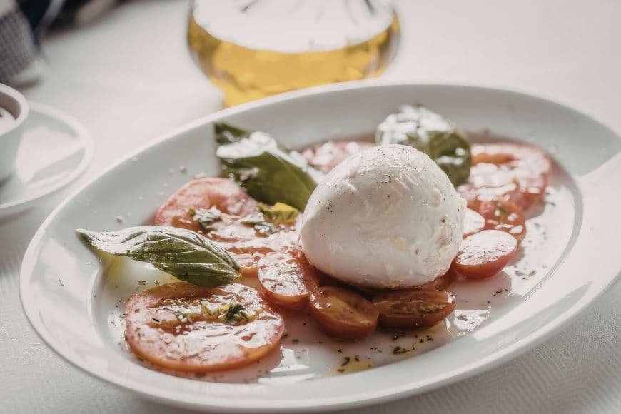 Puglia Travel Guide, Fresh burrata cheese served with tomatoes and olive oil