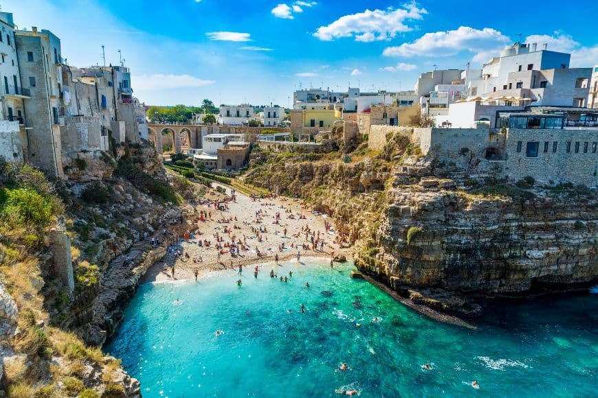 Puglia Travel Guide, Lama Monachile beach between cliffs in Polignano a Mare