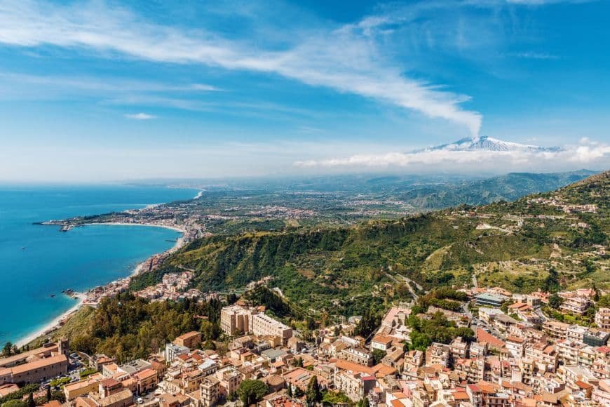 Southern Italy Travel Guide, Sicily Taormina coastal view mount Etna background