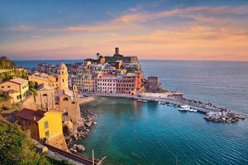 Things to Do in Cinque Terre, Vernazza harbor with colorful houses and fishing boats