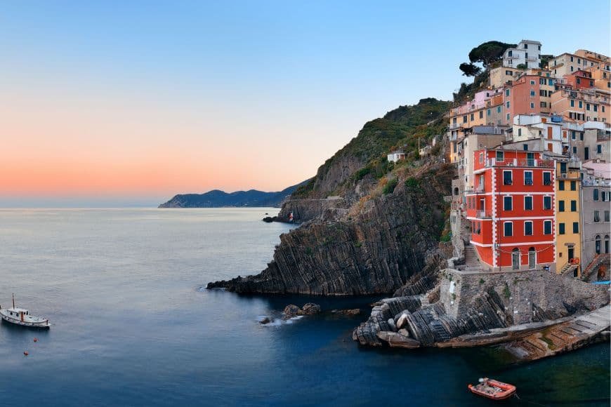 2 Days in Cinque Terre, View of Riomaggiore village climbing the cliffs above the sea