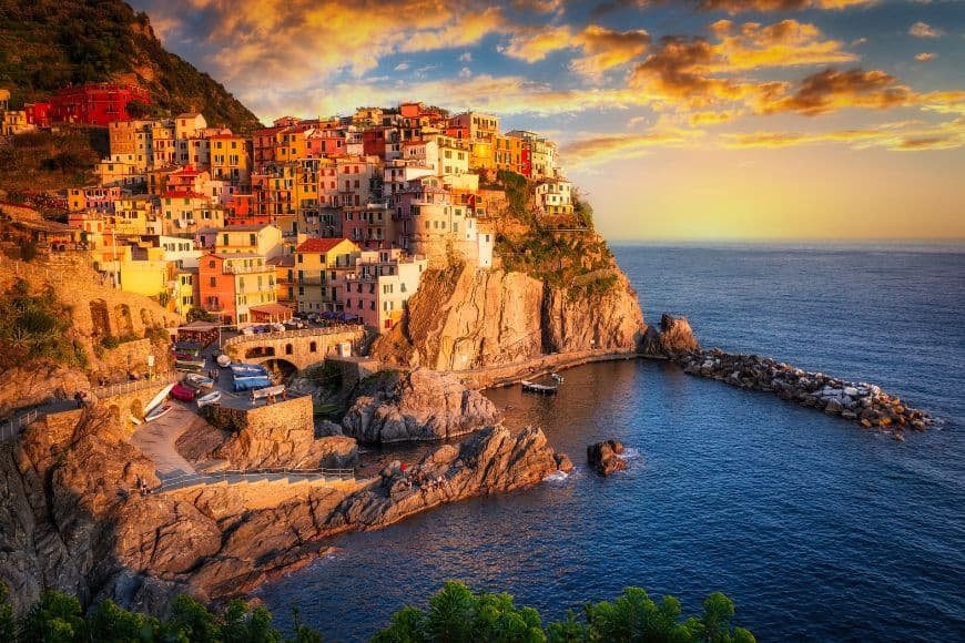 Things to Do in Cinque Terre, sunset view over Manarola village and the Ligurian Sea