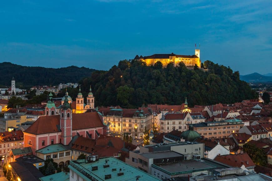 Ljubljana Travel Guide, Evening view of Ljubljana with the castle illuminated at sunset