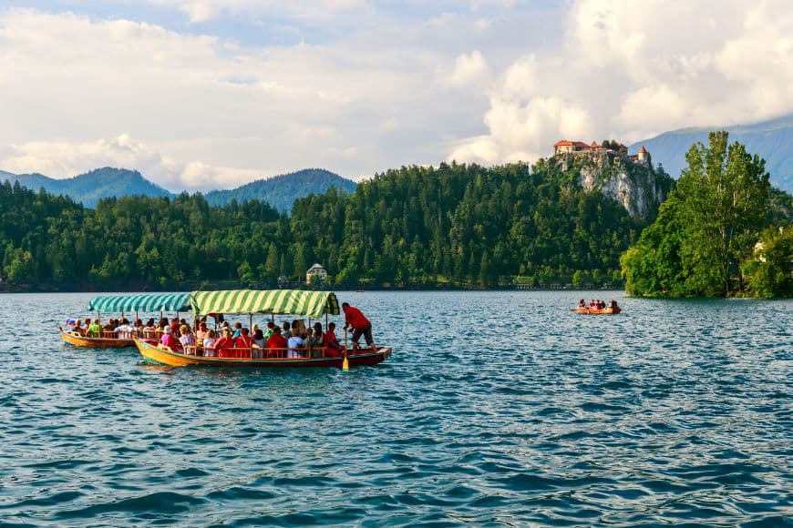 Slovenia Itinerary, Traditional Pletna boat crossing Lake Bled, Slovenia