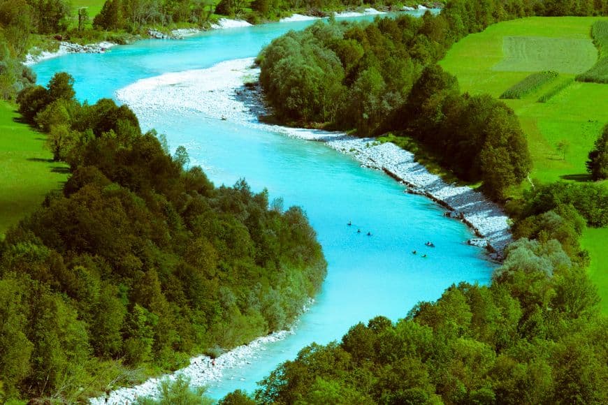 Slovenia Travel Guide, Turquoise Soča River flowing through the scenic Soča Valley in Slovenia