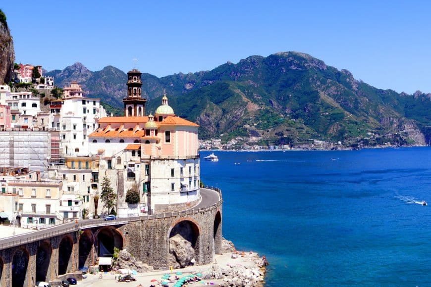 Small Towns in Italy to Visit, Colorful buildings and beach in Atrani on the Amalfi Coast
