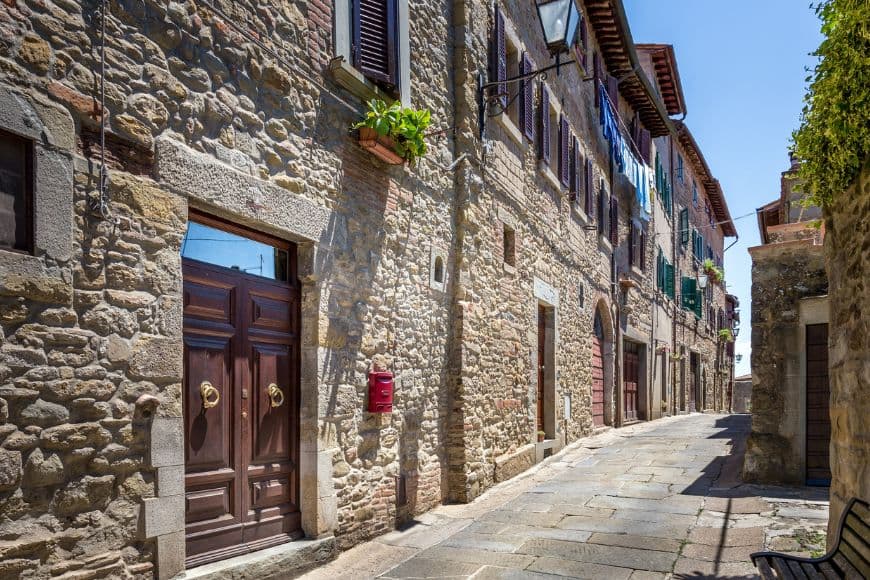 Small Towns in Italy to Visit,Historic stone streets and buildings in Cortona, Tuscany