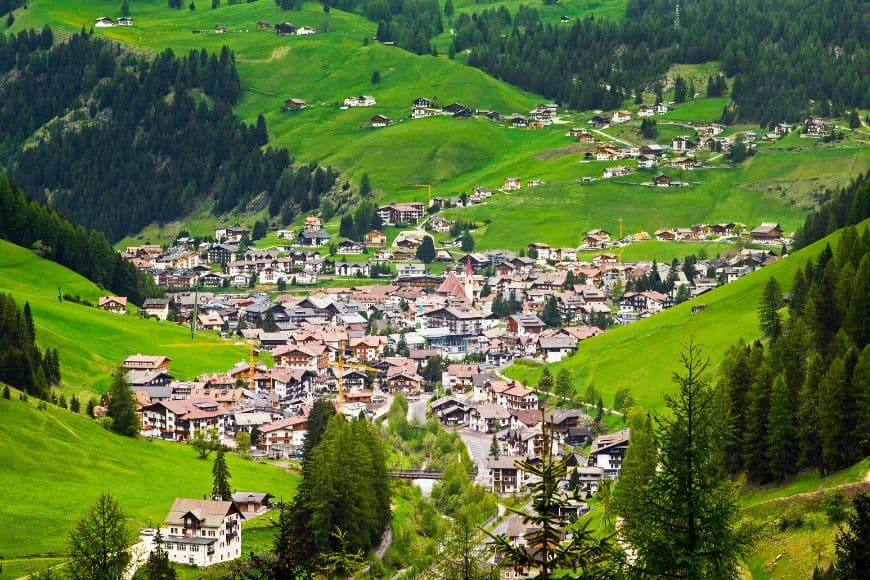 Small Towns in Italy to Visit, Ortisei surrounded by the mountain scenery of the Italian Dolomites