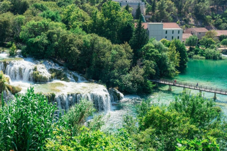 Skradinski Buk waterfalls surrounded by lush greenery in Krka National Park, Day Trips From Split
